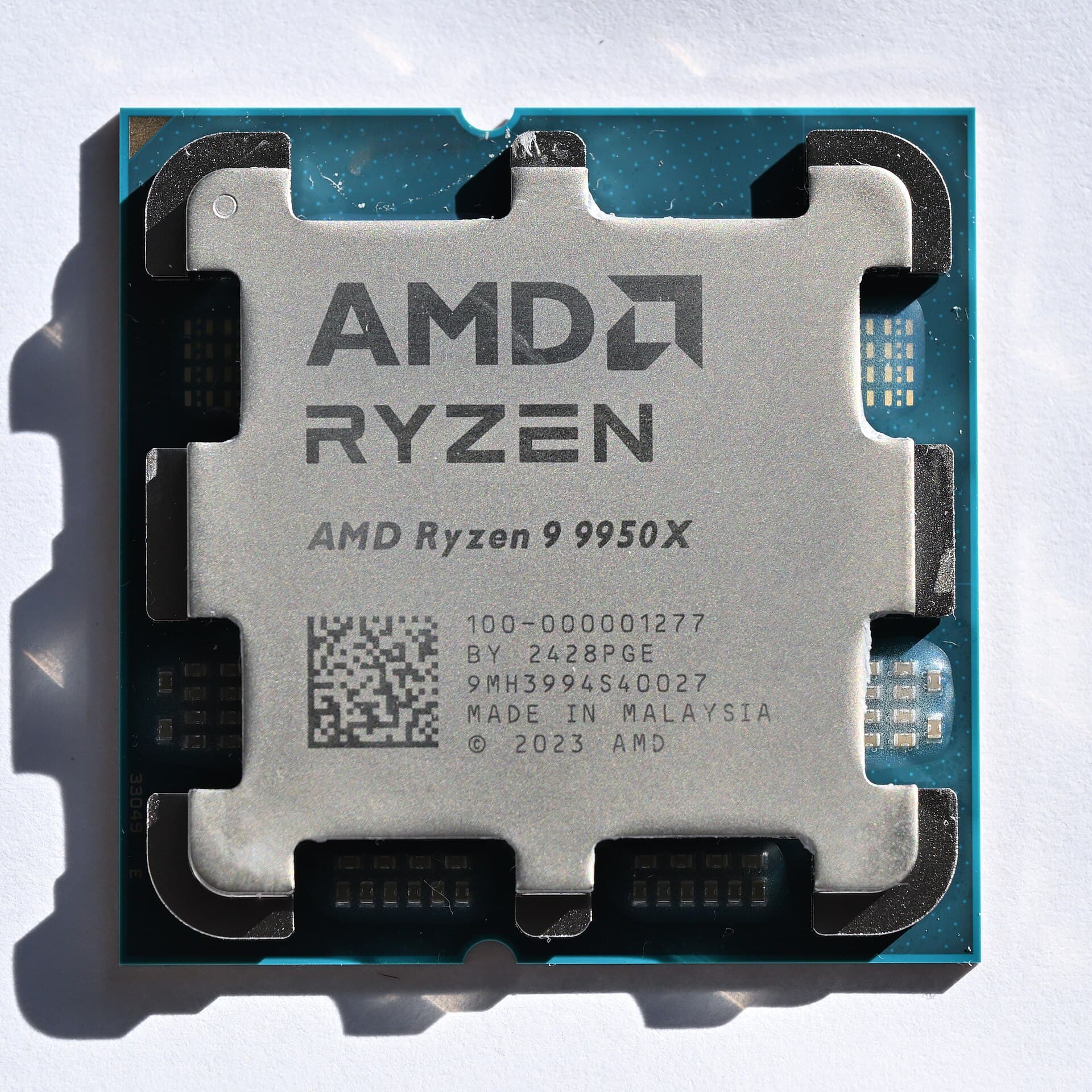 AMD Ryzen 9 9950X processor seen from above, its heat spreader marked with the model name